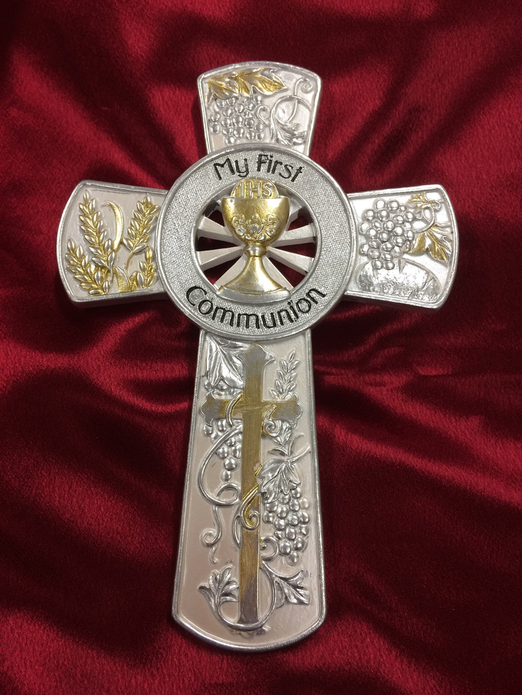 Silver and gold My First Communion cross.