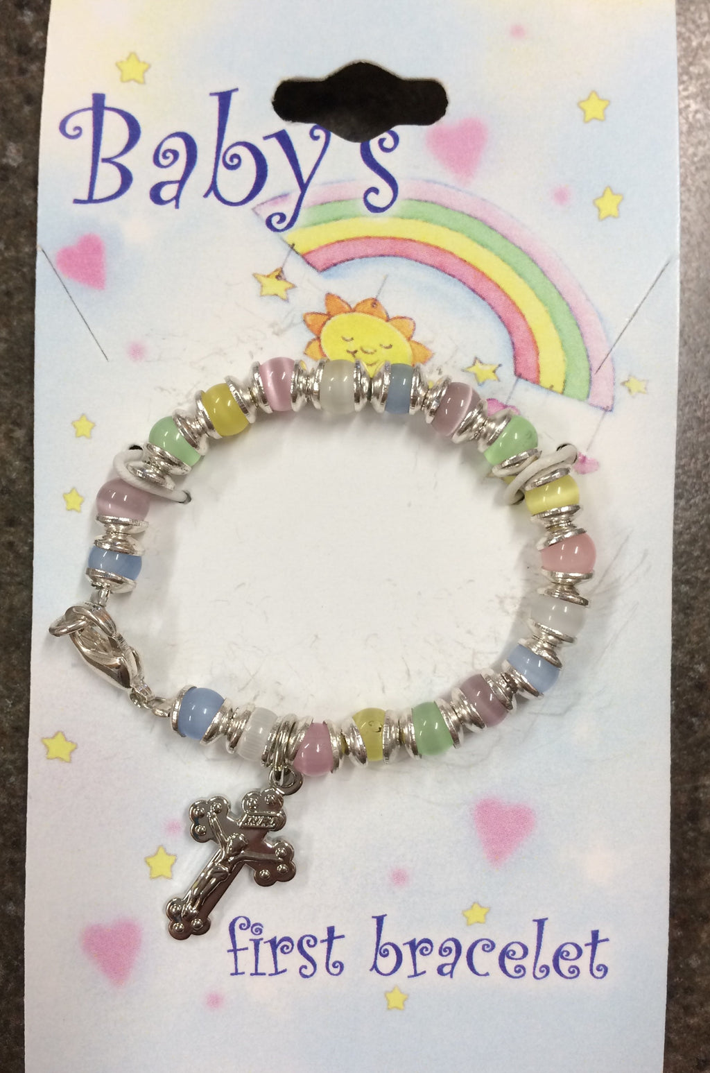 Baby bracelet with multicolored beads and silver crucifix. 