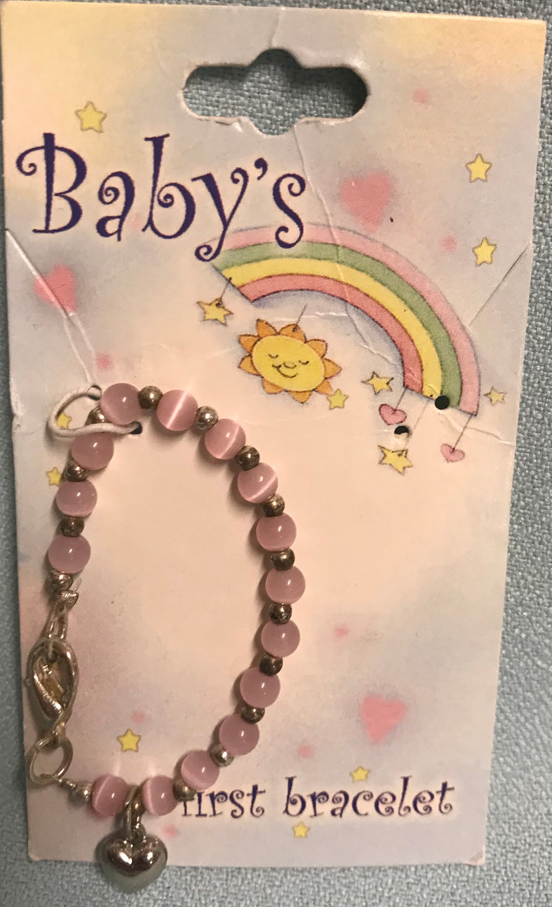 Baby bracelet with round pink beads and silver heart.